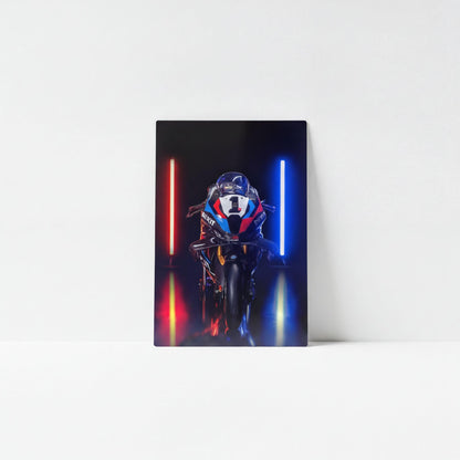 A motorcycle with a blue and red stripe is positioned in front of two glowing red and blue lights, creating a visually striking and dynamic scene.