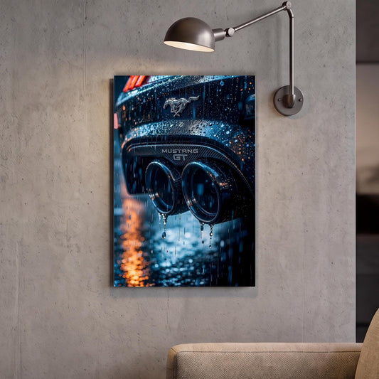 A framed photograph of a car's exhaust pipes is hanging on a wall, with raindrops visible on the surface.