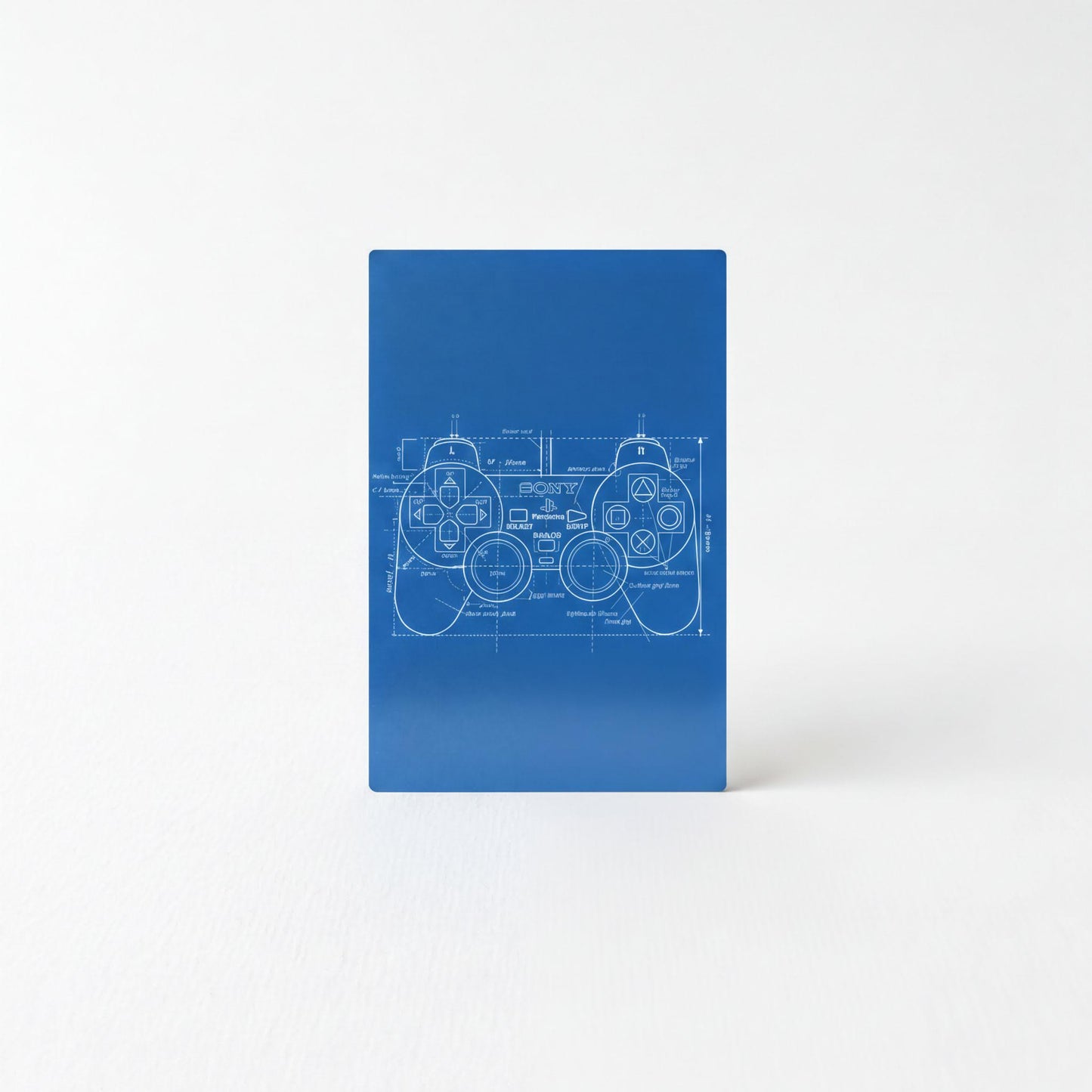 A blue object with a white technical drawing of a joystick on it.