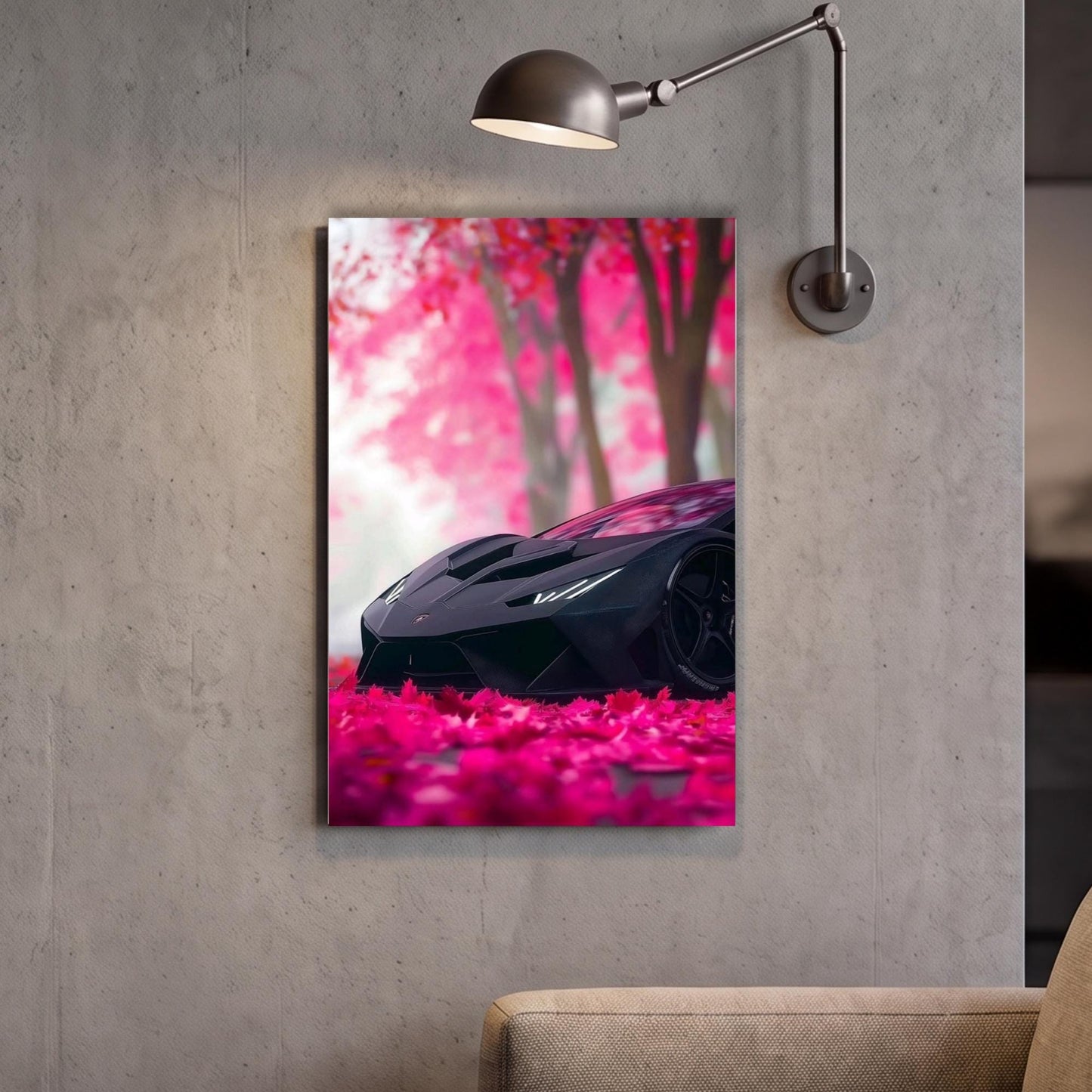A framed image of a black sports car parked on a bed of pink flowers, with a lamp fixture above it.